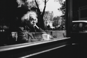 Paul Parsons AI Generated black and white image of Albert Einstein contemplating the city through the glass from a coffee shop